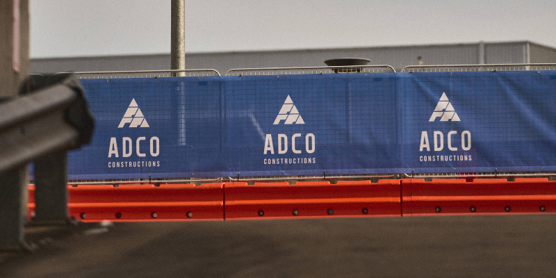 Banner mesh scrim installed on fencing