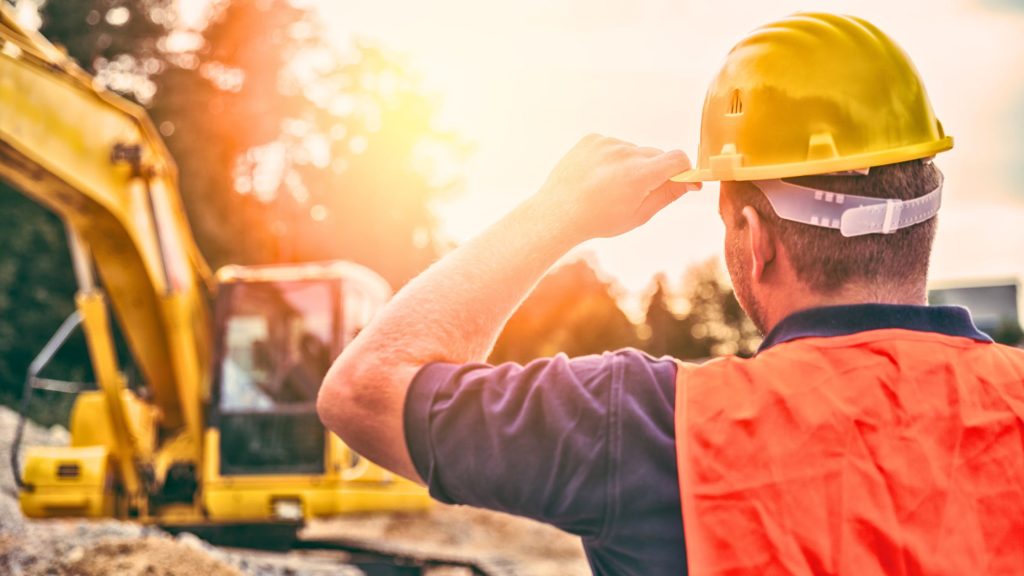 Worker on hot construction site